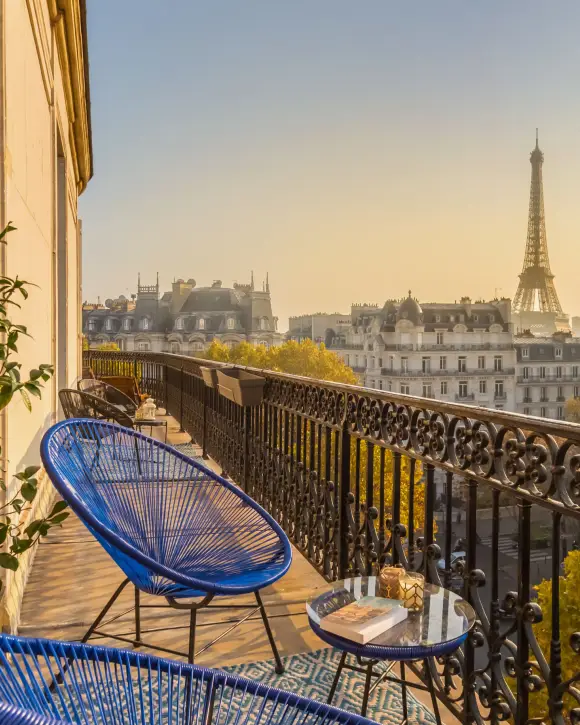 The balcony of a Paris apartment and the Eiffel Tower at the end of the day