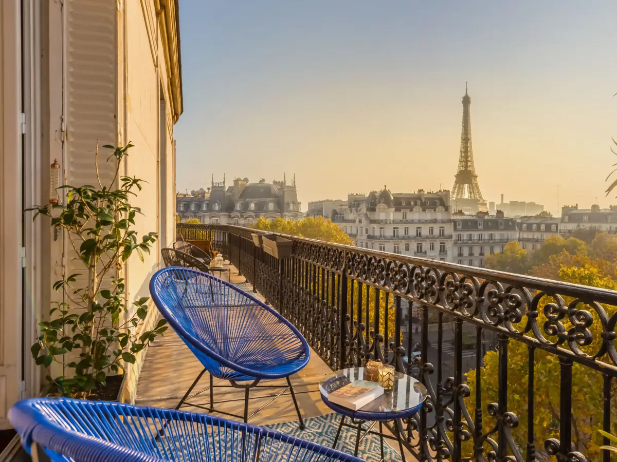 The balcony of a Paris apartment and the Eiffel Tower at the end of the day