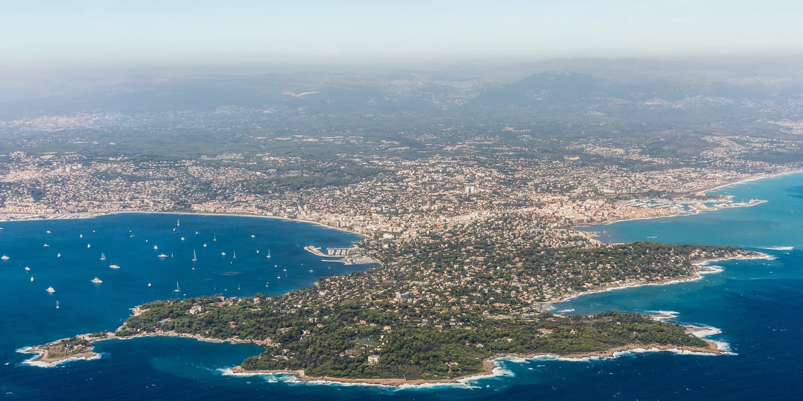 The Cap d’Antibes, its umbrella pines and the villas under the palm trees