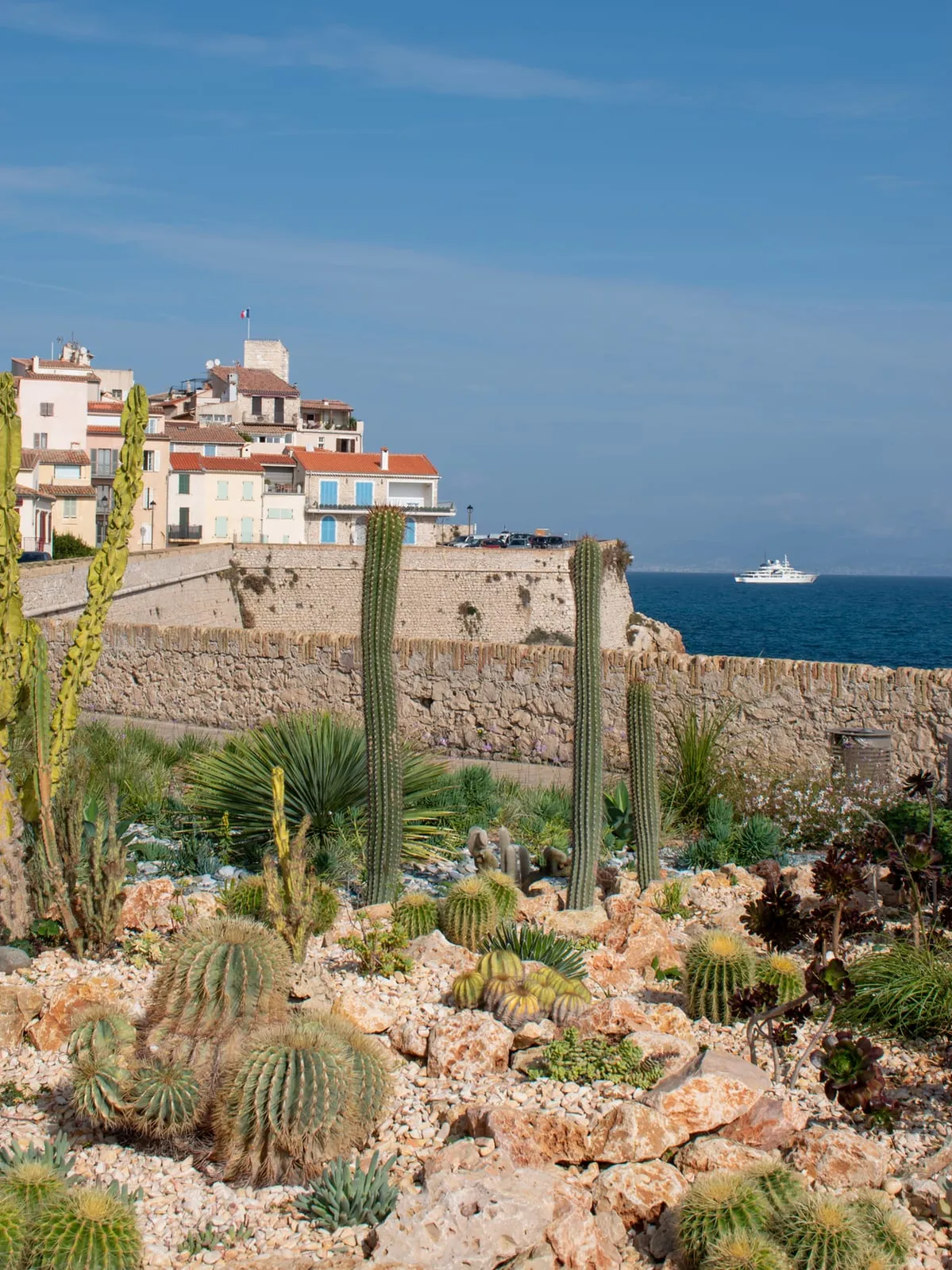 The stone ramparts between the pines and the sea, the old town and its bell tower