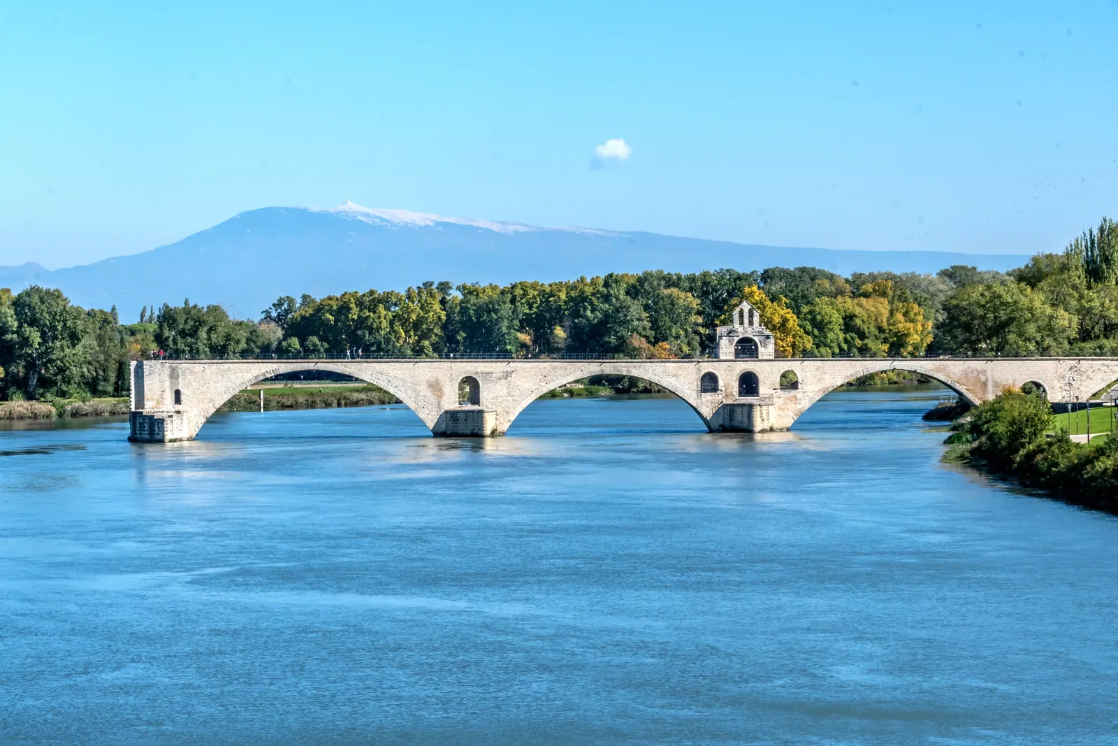 The Saint-Bénézet bridge of Avignon over the Rhône, with Mont Ventoux on the horizon