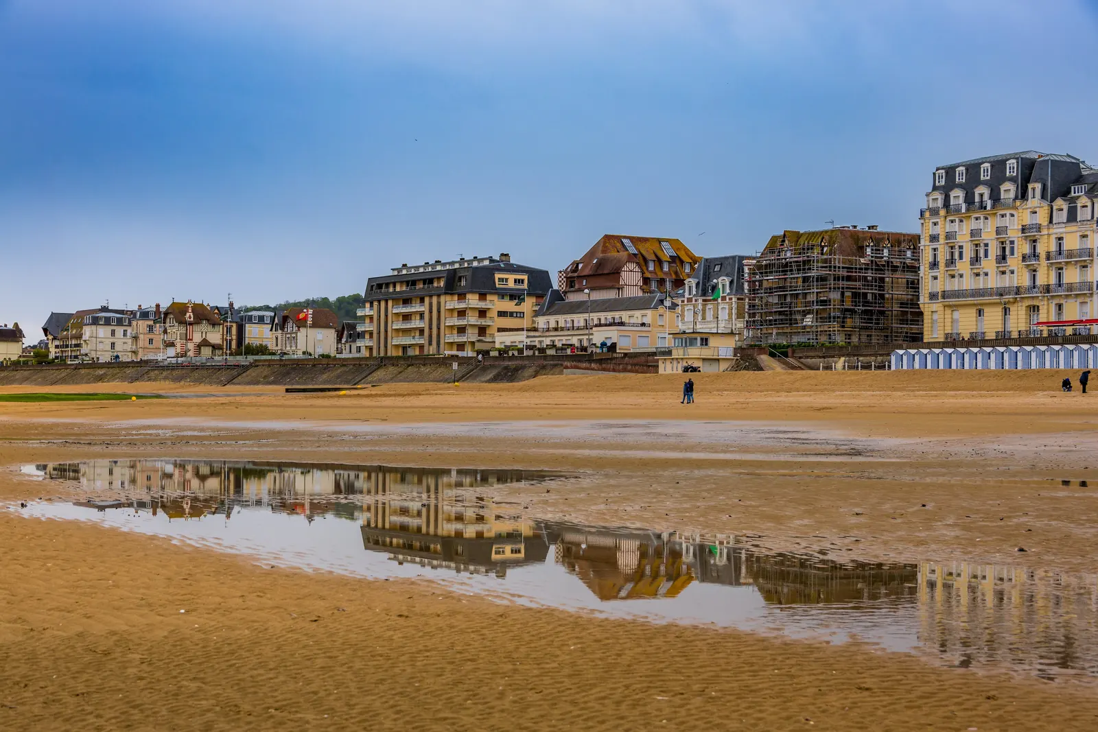 Cabourg beach at low tide, the Grand Hôtel and the seafront villas reflected in the wet sand