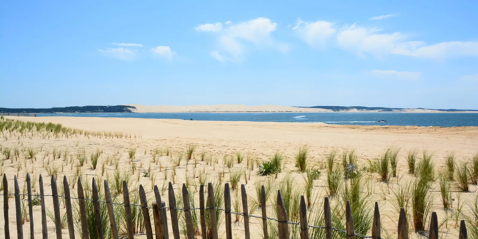 The beach at the tip of Cap Ferret, with the Dune du Pilat across the channel