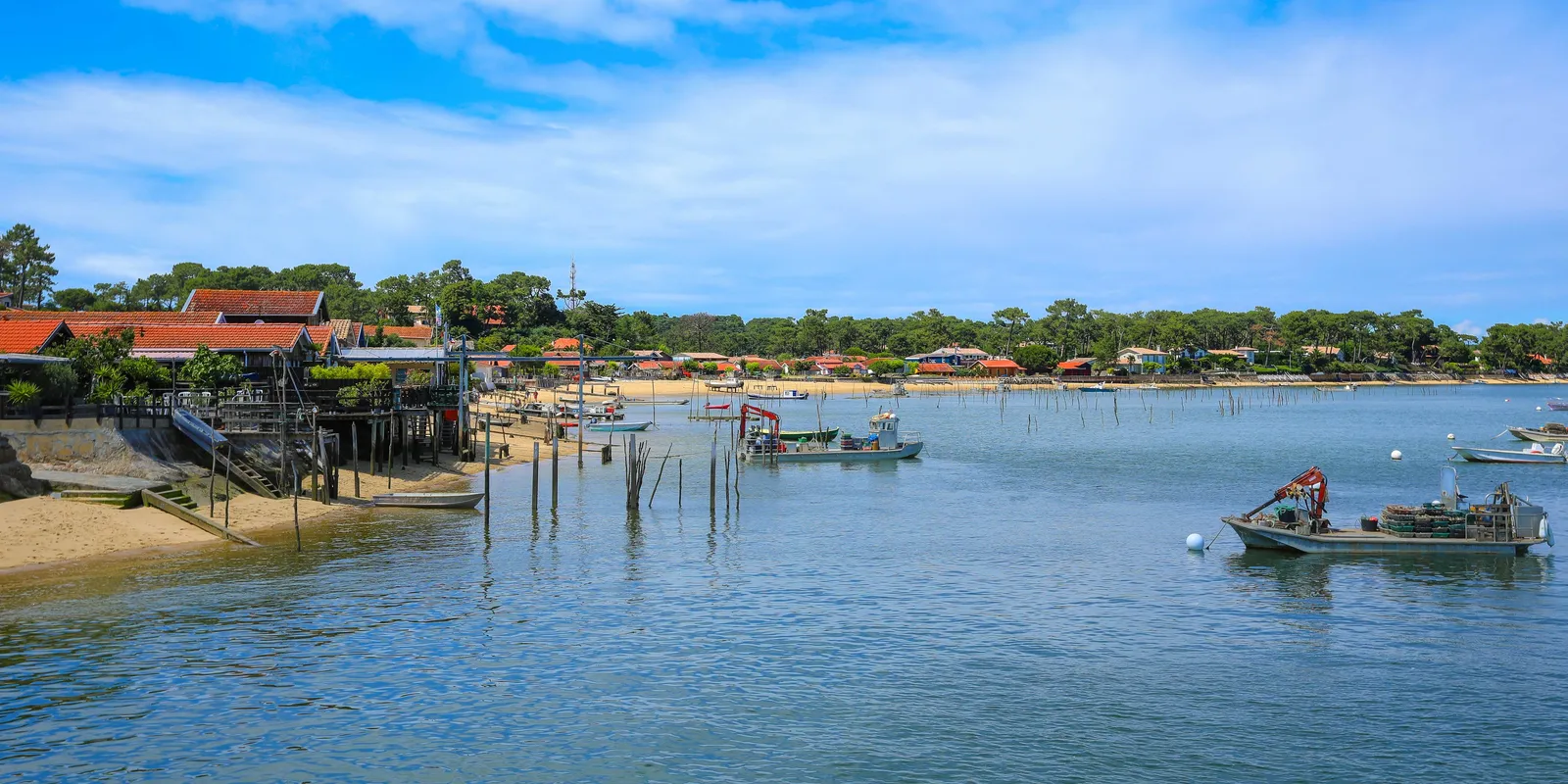 An oyster port of Cap Ferret and its huts on the edge of the bay