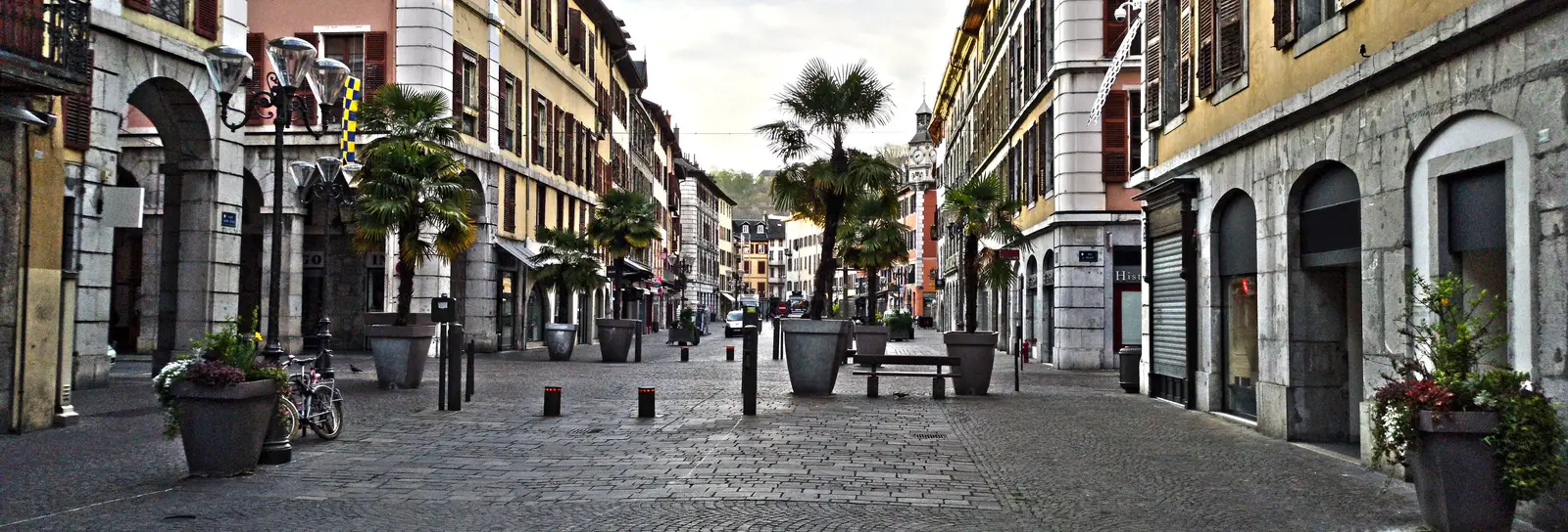 Place Saint-Léger in the old centre of Chambéry, its fountain, its potted palms and its colourful façades with painted shutters