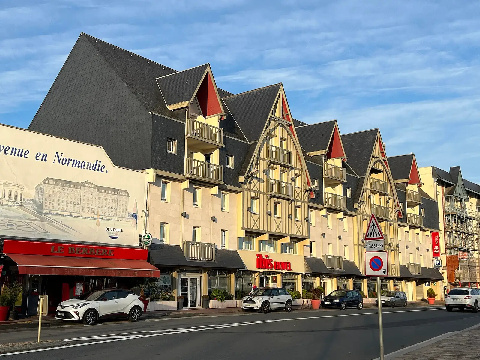 Norman hotel in Deauville, light half-timbering and tall slate roofs seen from the street