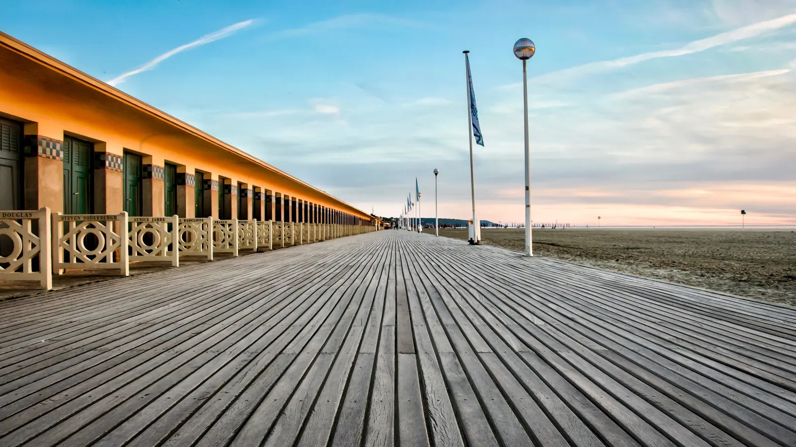 Les Planches, Deauville’s wooden boardwalk, and the beach stretching into the distance
