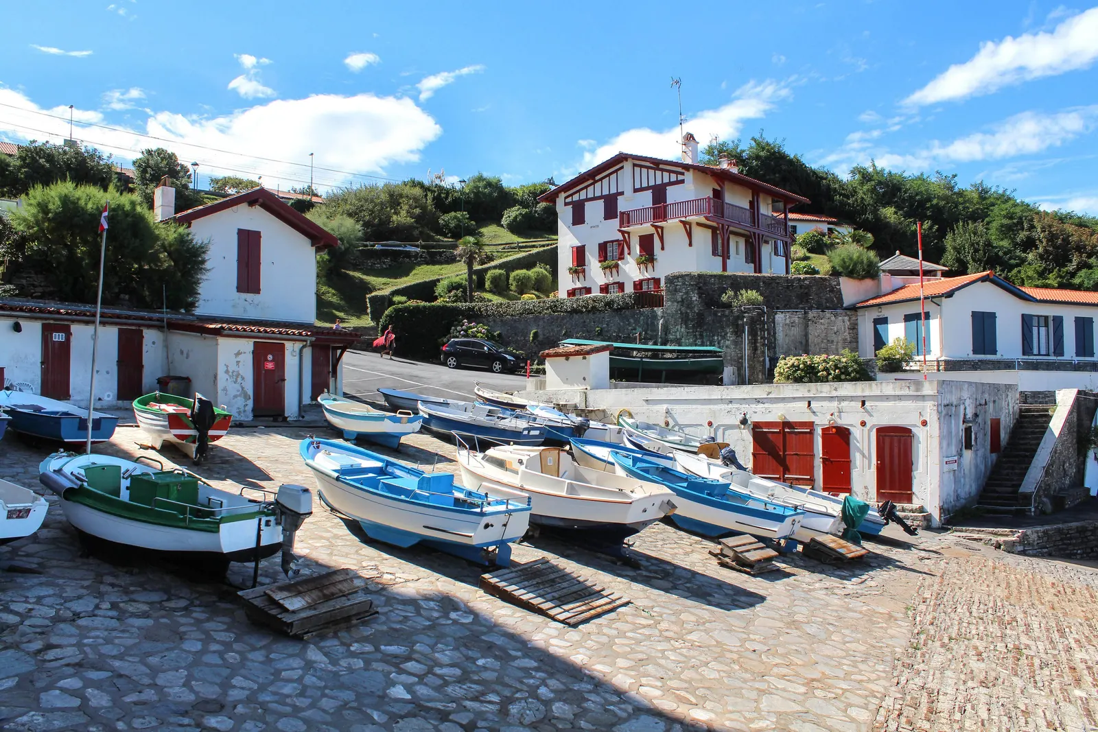 The harbour of Guéthary, its boats hauled up on the slipway and the white Basque houses with red shutters