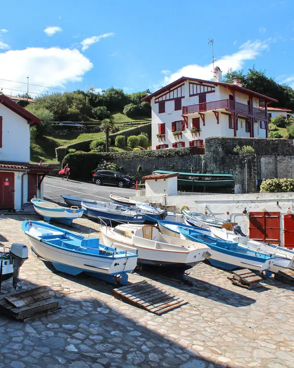 The harbour of Guéthary, its boats hauled up on the slipway and the white Basque houses with red shutters
