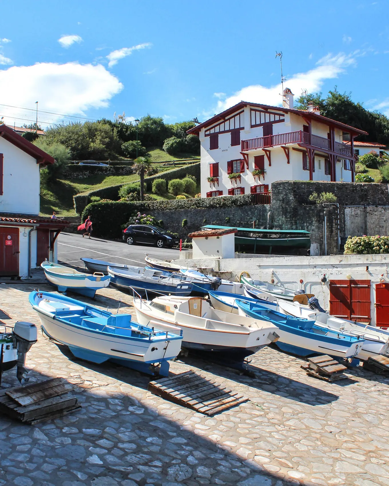 The harbour of Guéthary, its boats hauled up on the slipway and the white Basque houses with red shutters