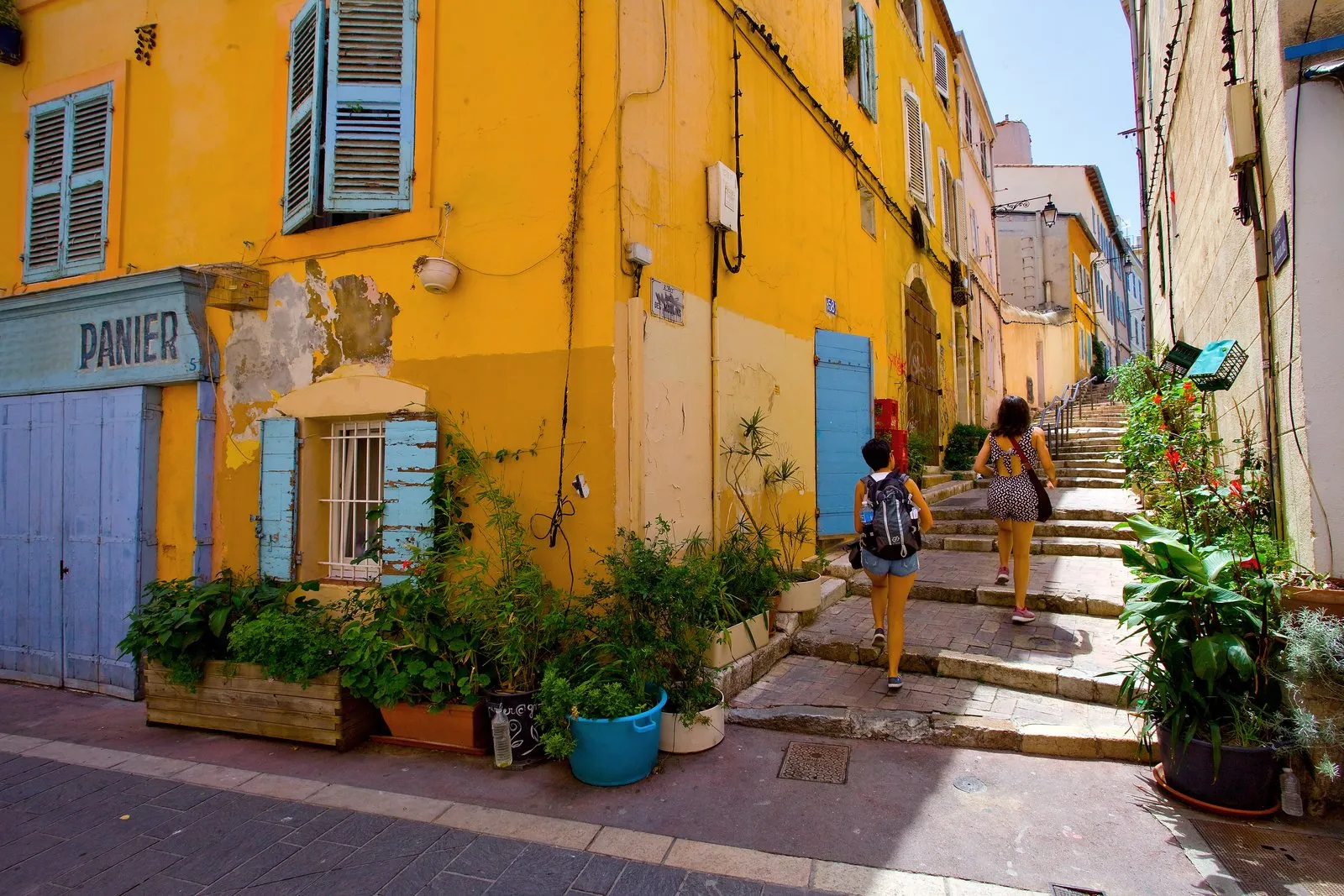 Le Panier in Marseille, a stepped street between ochre façades and blue shutters