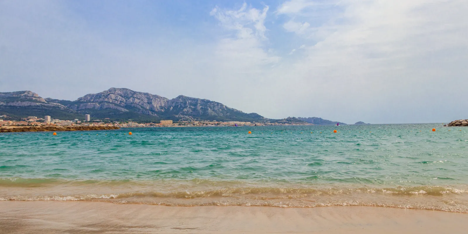 The Prado beaches in Marseille, the turquoise sea and the Marseilleveyre massif beyond