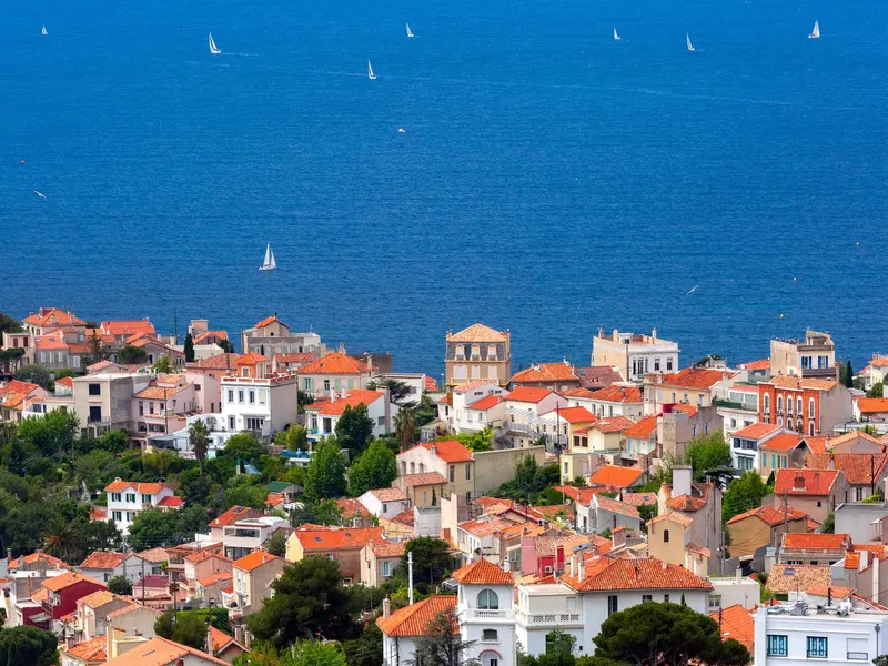 The tiled roofs of a Marseille neighbourhood facing the sea