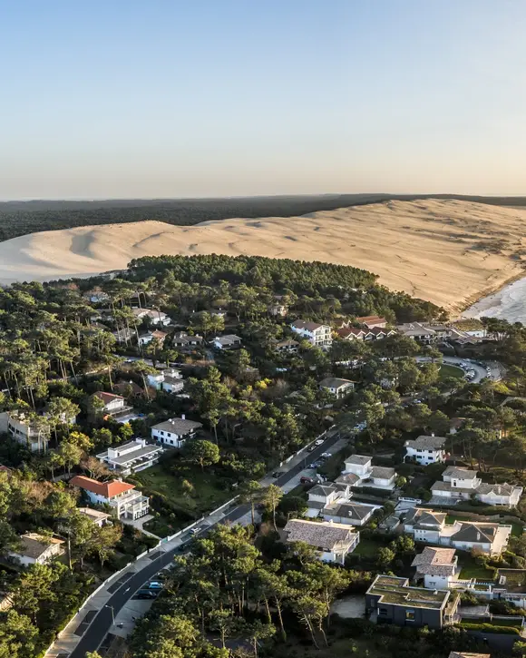 Pyla-sur-Mer and its villas among the pines, the Dune du Pilat and the ocean at sunset, seen from the sky