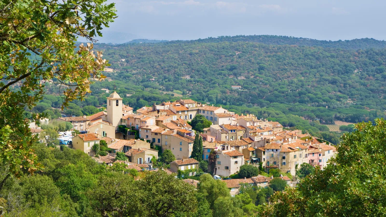 The hilltop village of Ramatuelle, its tiled roofs and bell tower above the pines