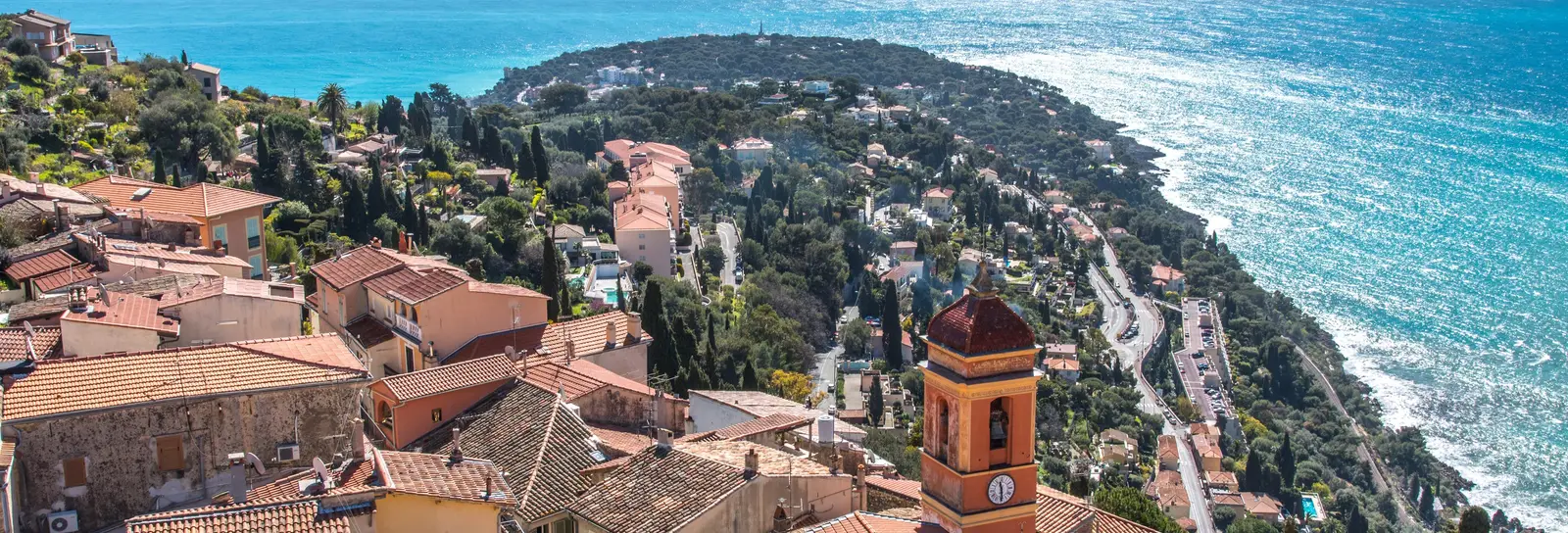 The old village of Roquebrune and its bell tower above Cap Martin and the sea