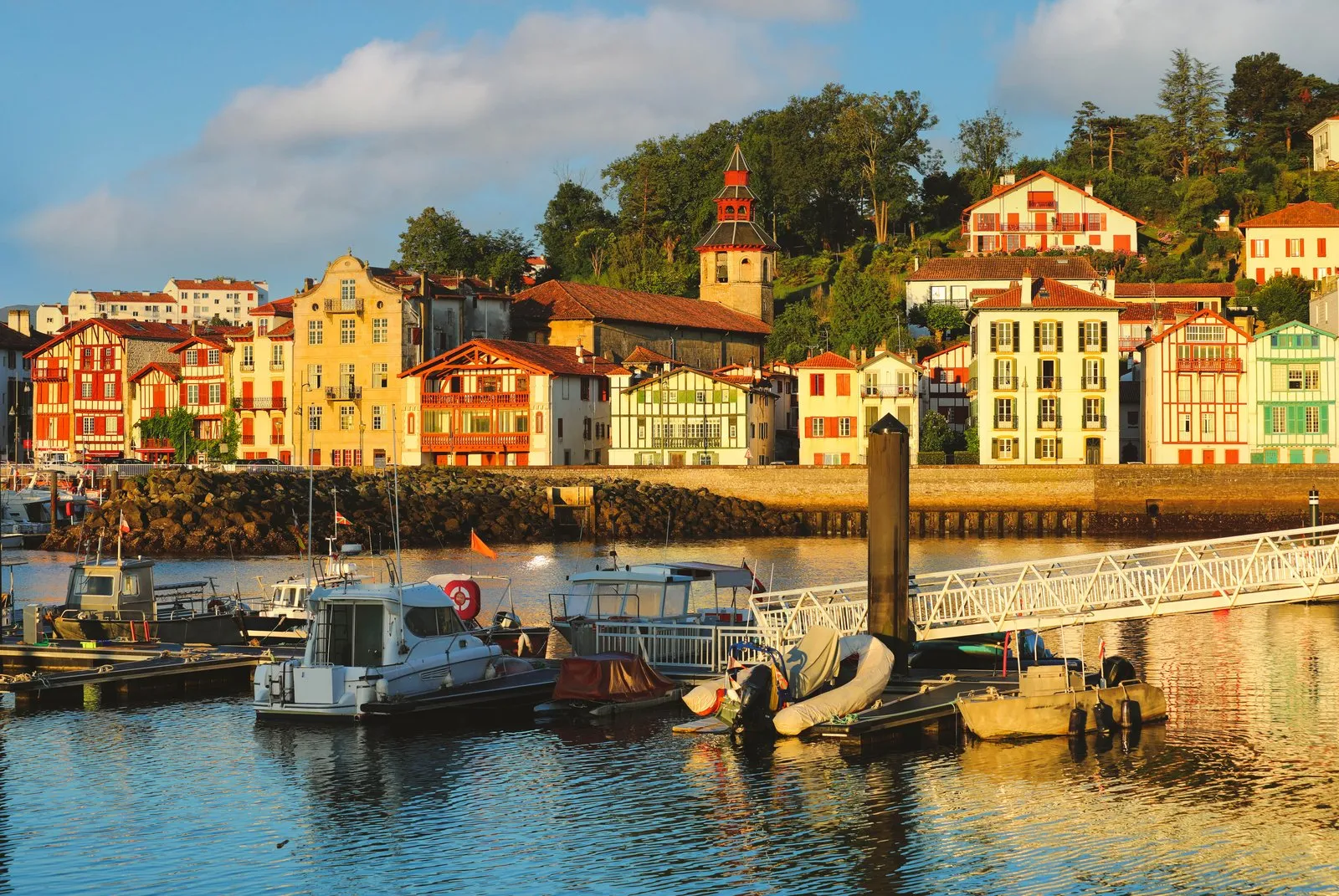 The red and white Basque houses of Saint-Jean-de-Luz harbour, seen from the quay