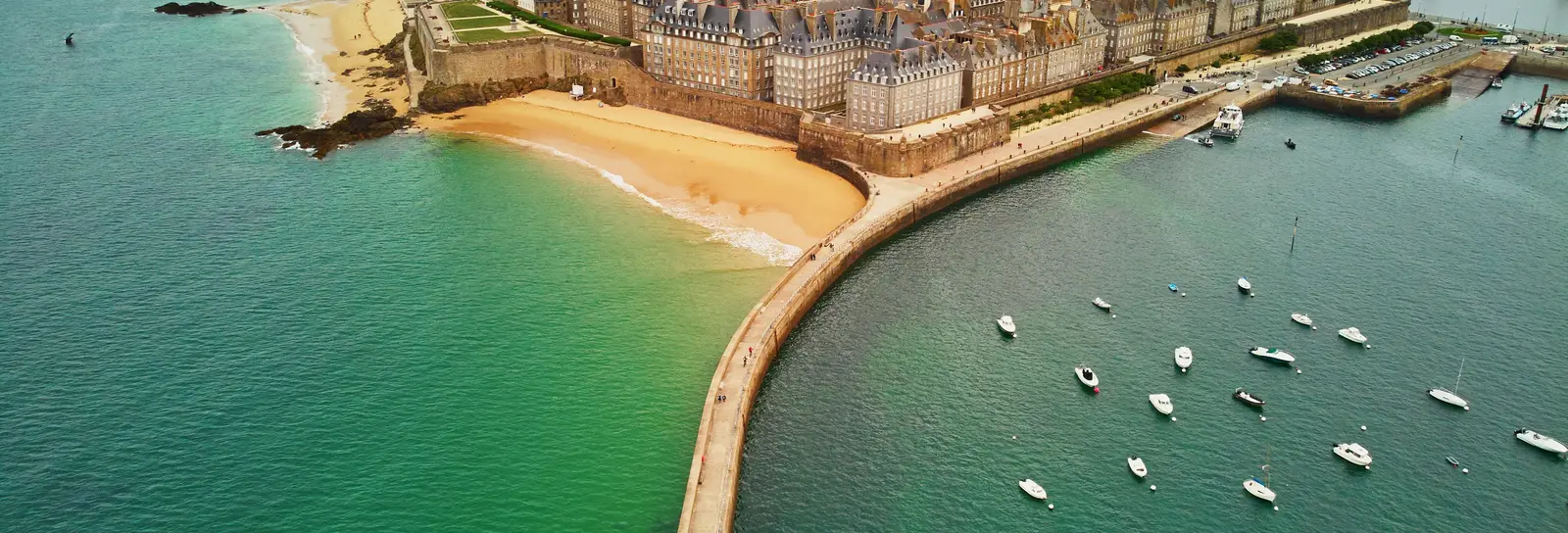 The walled city of Saint-Malo seen from the sky, the Môle des Noires jetty and the harbour