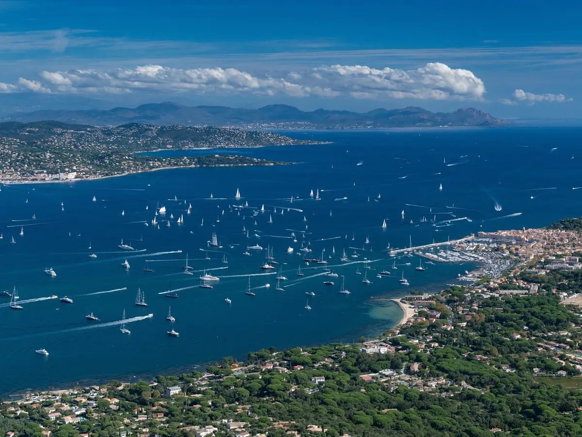 The gulf of Saint-Tropez from the air, its yachts and the town in the distance