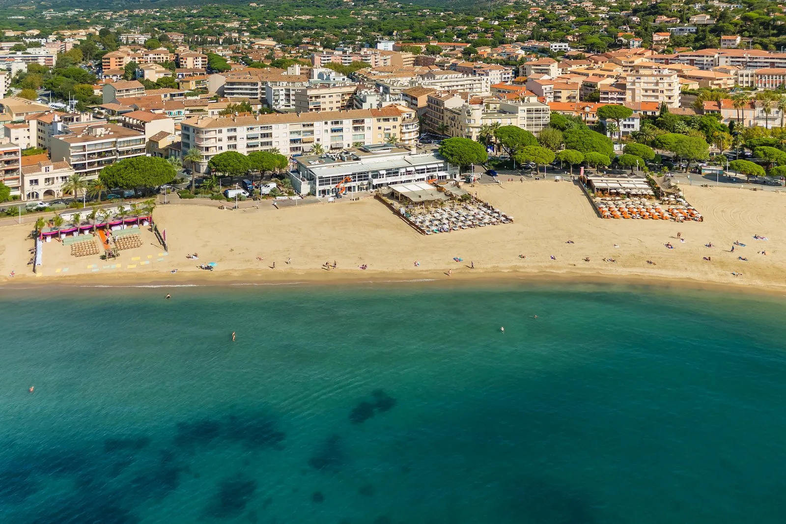 Sainte-Maxime’s main beach from the air, its umbrella pines and the seafront buildings