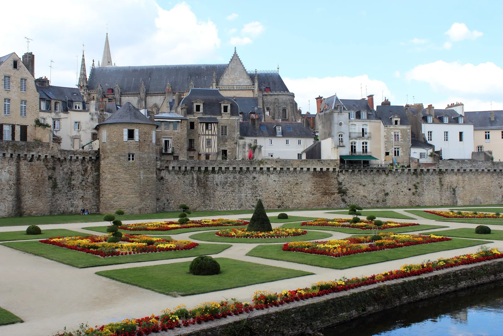 The rampart gardens of Vannes, their flowerbeds at the foot of the walls, and Saint-Pierre cathedral above the rooftops