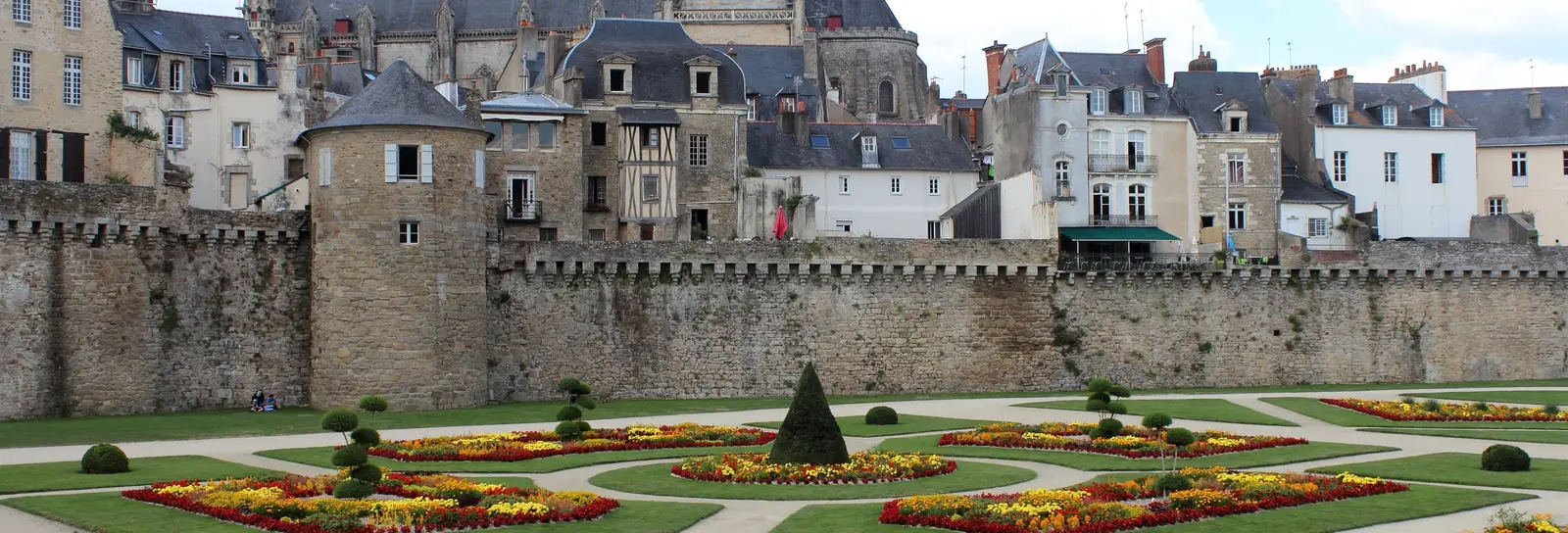 The rampart gardens of Vannes, their flowerbeds at the foot of the walls, and Saint-Pierre cathedral above the rooftops