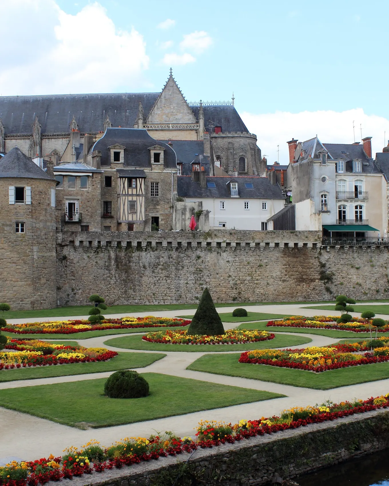 The rampart gardens of Vannes, their flowerbeds at the foot of the walls, and Saint-Pierre cathedral above the rooftops
