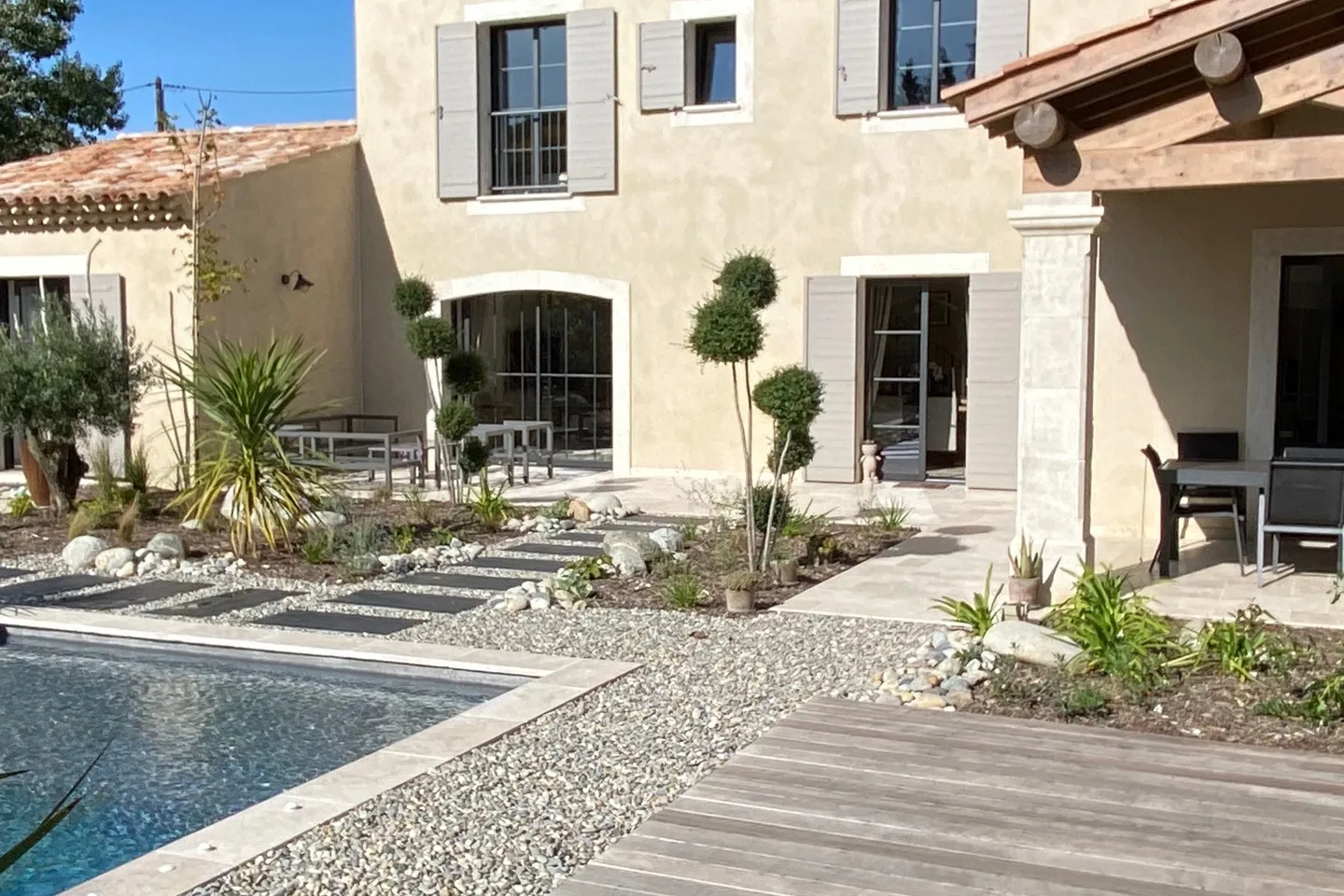 Provençal villa and its pool, wooden terrace in the southern sun